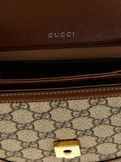 Flap Handbag by Gucci for women in poly cotton & leather brown & signature presents a ornamental silhouette, showcasing a secure flap & magnetic, ample , and versatile shoulder-strap & handle for a ornamental finish.
