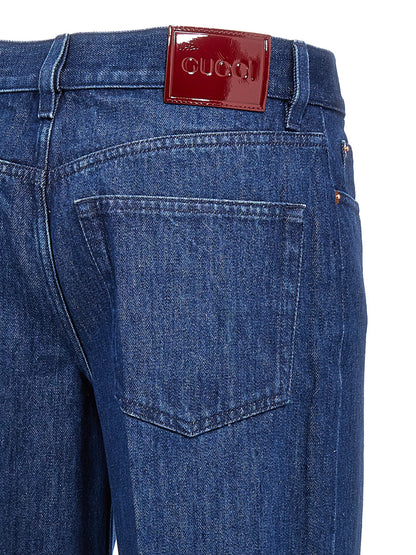 Jeans by Gucci for women in cotton denim blue & signature presents a refined pantology silhouette, artfully defined by a refined pantology straight-leg, long, and a sophisticated .