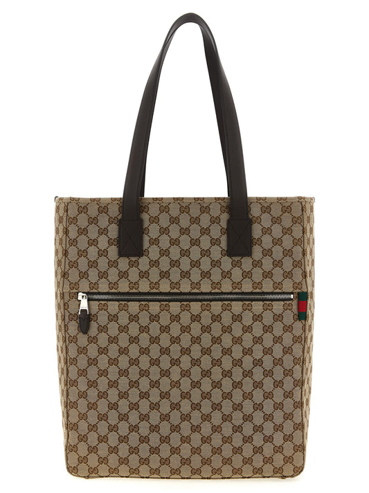 Shoulder Bag by Gucci for men in poly cotton & leather brown, signature & monogram features a distinguished silhouette, showcasing a secure zipper and distinguished with versatile shoulder-strap & handle for a distinguished finish.