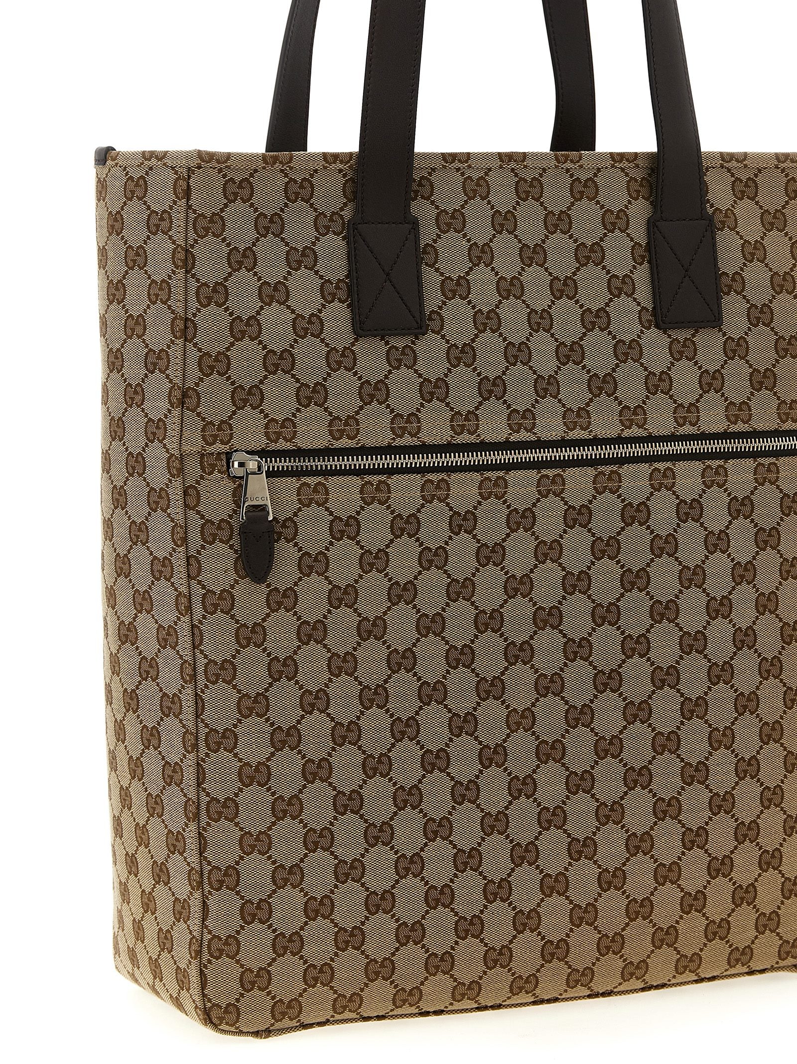 Shoulder Bag by Gucci for men in poly cotton & leather brown, signature & monogram presents a versatile silhouette, showcasing a secure zipper and versatile with versatile shoulder-strap & handle for a sophisticated look.