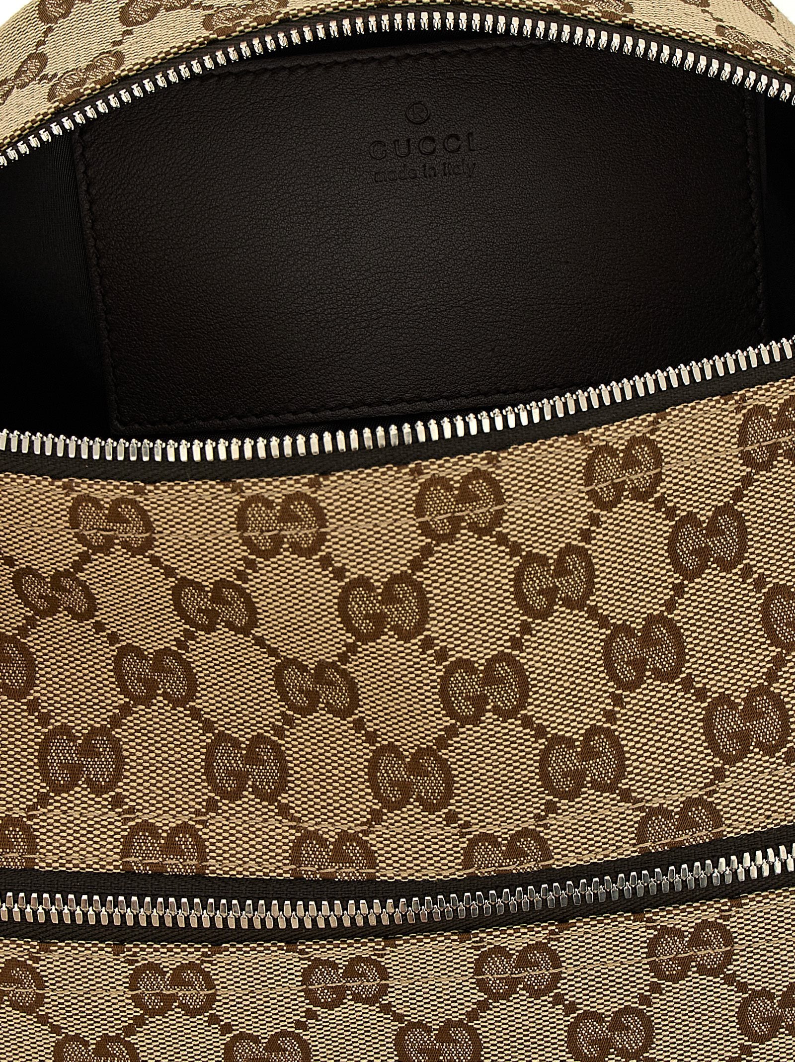 Small Crossbody Messenger Bag by Gucci for men in poly cotton & leather beige features an fashionable Gg Poly Cotton & Leather Small Crossbody Messenger Bag design with a fashionable zipper, ample , and versatile crossbody-strap, shoulder-strap & adjustable-strap for a sophisticated finish.