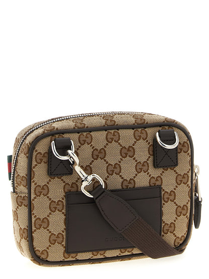 Crossbody Messenger Bag by Gucci for men in poly cotton & leather beige & signature features a statement-making Gg Ribbon Poly Cotton & Leather Crossbody Messenger Bag design with a secure zipper, statement-making cardholder, and versatile crossbody-strap & adjustable-strap for a sophisticated look.