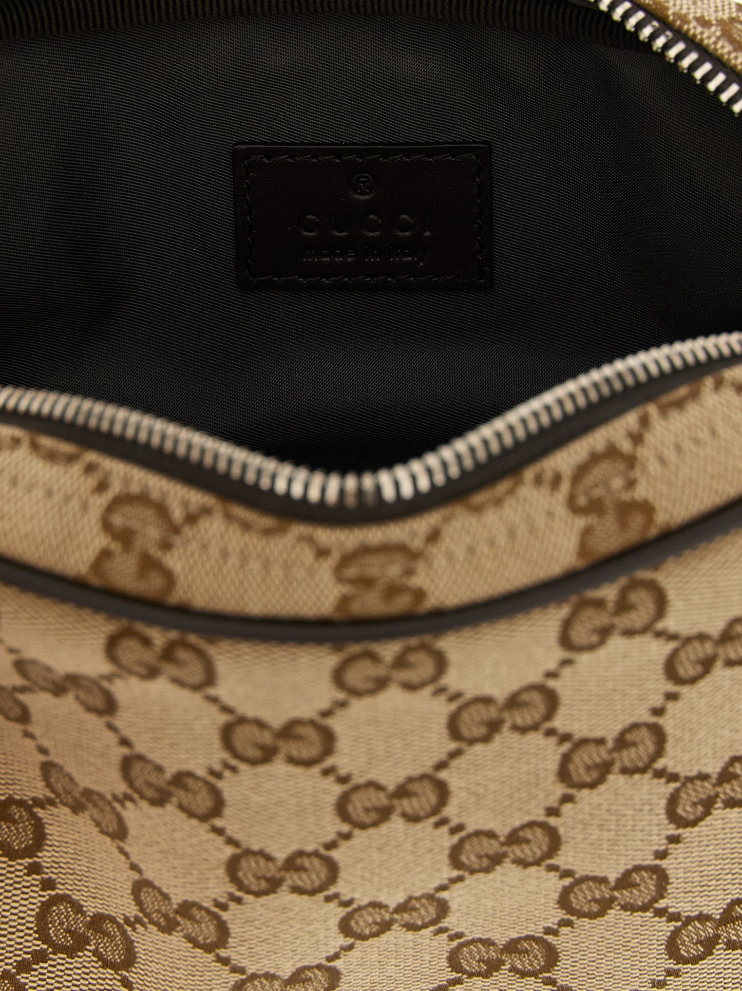 Crossbody Messenger Bag by Gucci for men in poly cotton & leather beige & signature features a distinguished Gg Ribbon Poly Cotton & Leather Crossbody Messenger Bag design with a secure zipper, ample cardholder, and versatile crossbody-strap & adjustable-strap for a distinguished look.