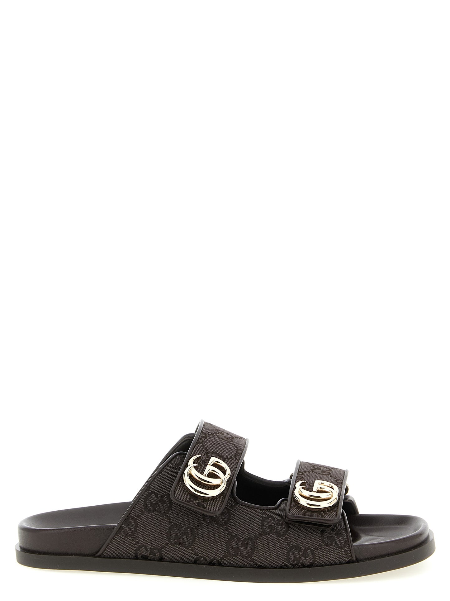 Sliders Flat Shoes by Gucci for women in rubber polyester leather & cotton brown showcases a enchanting silhouette as part of the Gg Women's Rubber Polyester Leather & Cotton Sliders Flat Shoes collection, defined by a enchanting and for a enchanting look.