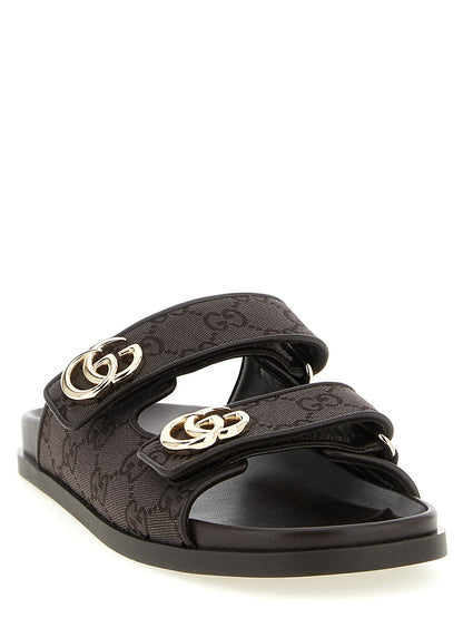 Sliders Flat Shoes by Gucci for women in rubber polyester leather & cotton brown features an statuesque silhouette from the Gg Women's Rubber Polyester Leather & Cotton Sliders Flat Shoes collection, showcasing a and a statuesque for a statuesque look.