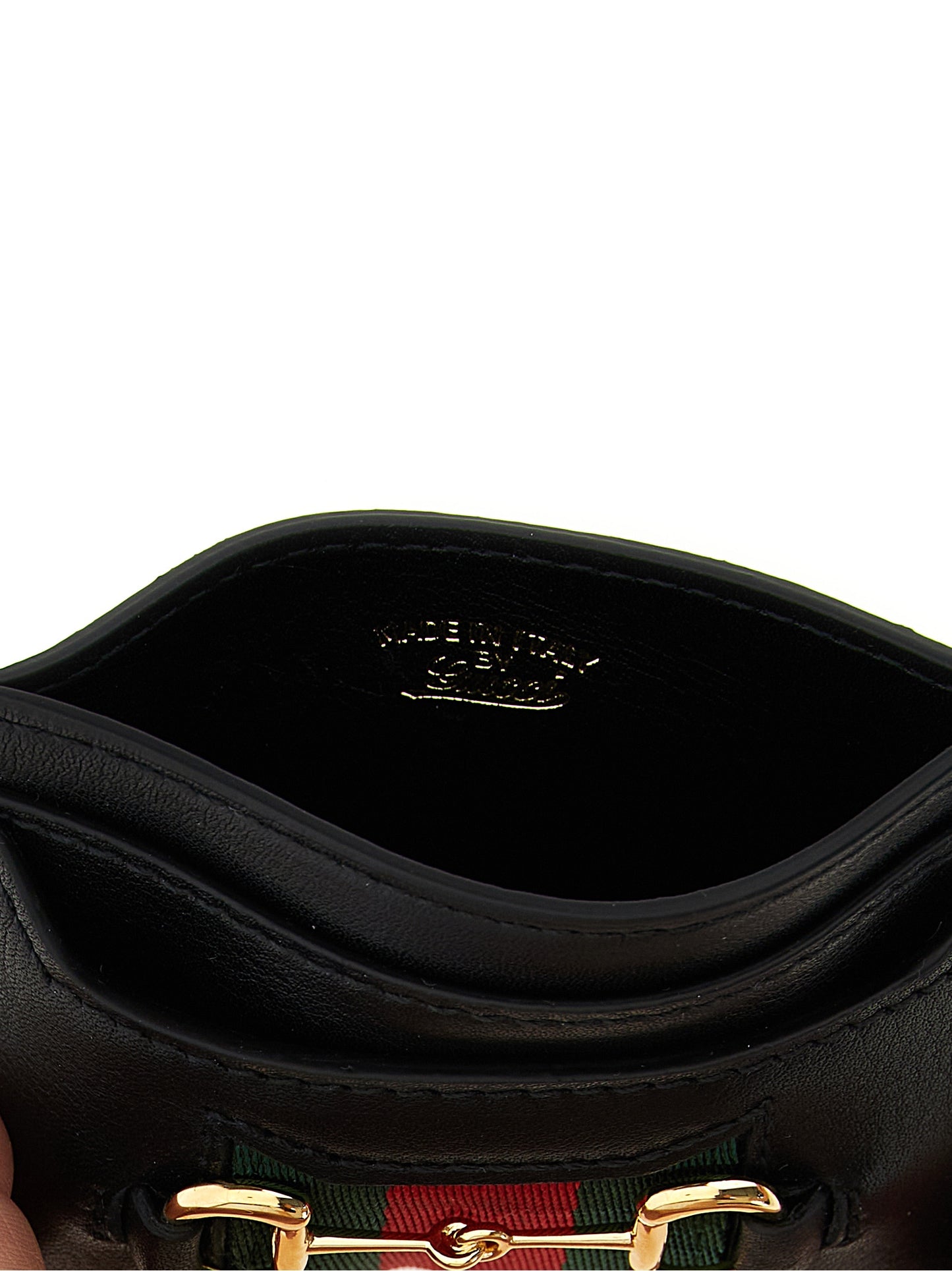 Cardholder Card Case by Gucci for women in calfskin leather black & signature features a sleek silhouette, showcasing the sleek design of the Horsebit Calfskin Leather Cardholder Card Case with functional card-organization for a premium look.