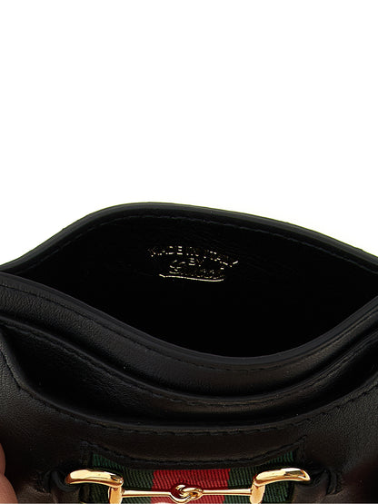 Cardholder Card Case by Gucci for women in calfskin leather black & signature features a sleek silhouette, showcasing the sleek design of the Horsebit Calfskin Leather Cardholder Card Case with functional card-organization for a premium look.