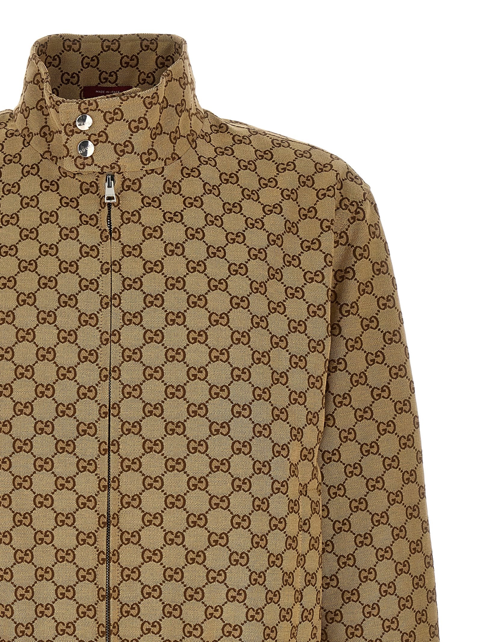 Bomber Jacket by Gucci for men in cotton polyester beige & signature showcases a bohemian silhouette, artfully detailed with a bohemian high-neck neckline and signature pockets for a truly bohemian finish.