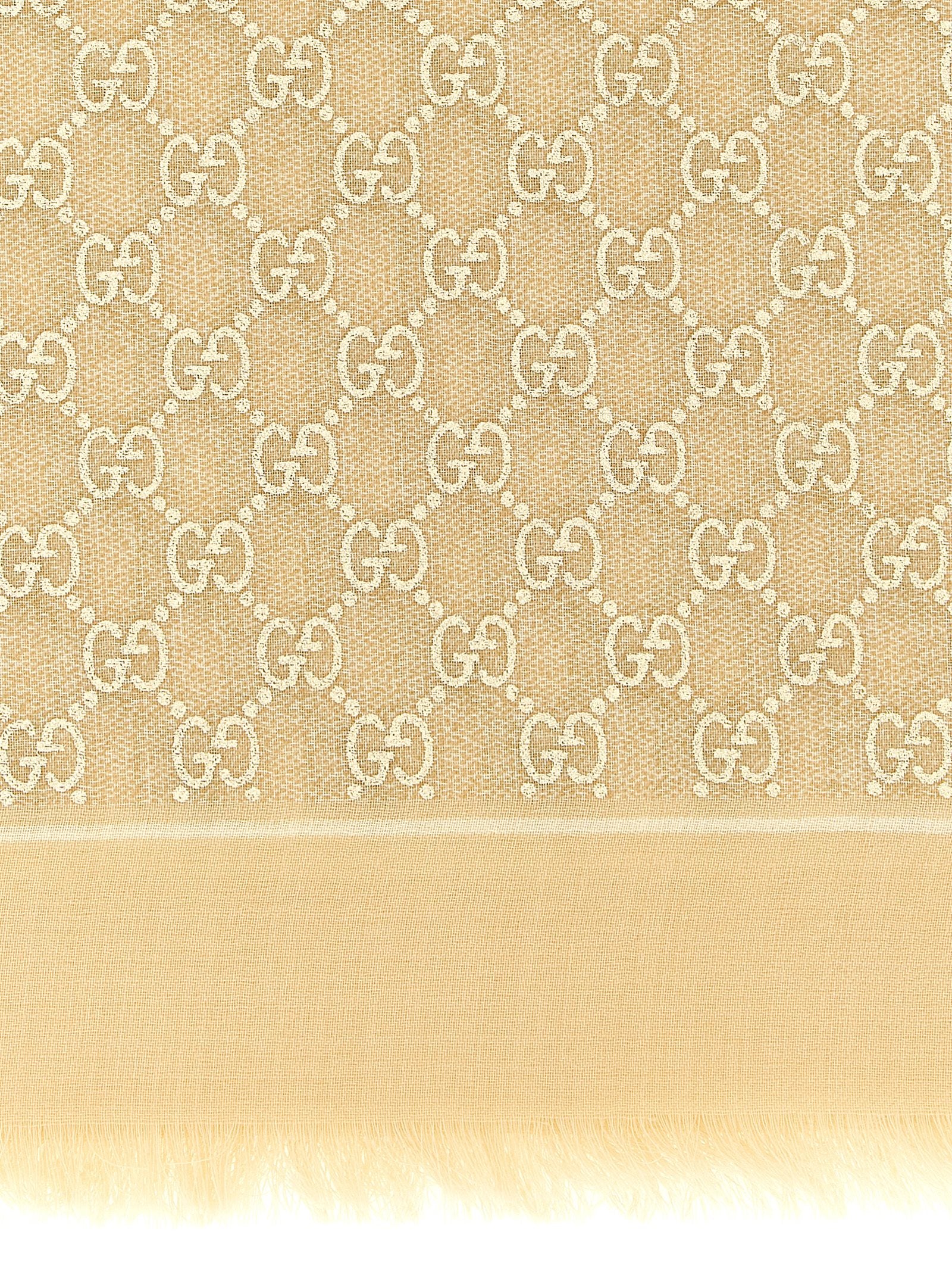 Scarf by Gucci for women in wool beige & jacquard showcases a eye catching silhouette, artfully capturing the essence of the eye catching Gg Wool Rectangular Fringes Scarf design for a sophisticated look.