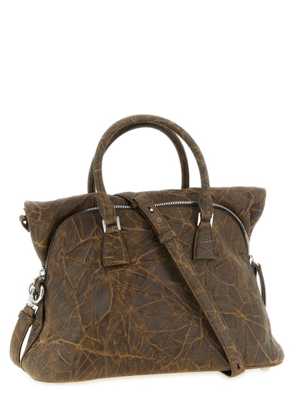Shoulder Bag by Maison Margiela for women in viscose goat leather & fur brown & silver presents a versatile silhouette, showcasing a secure and versatile with versatile shoulder-strap & adjustable-strap for a sophisticated look.