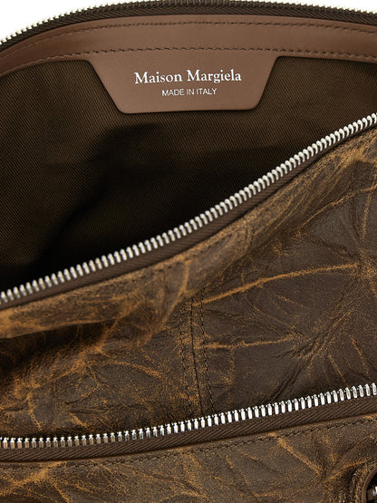 Shoulder Bag by Maison Margiela for women in viscose goat leather & fur brown & silver features a effortless sophistication silhouette, secured by a with ample and versatile shoulder-strap & adjustable-strap for a effortless sophistication finish.