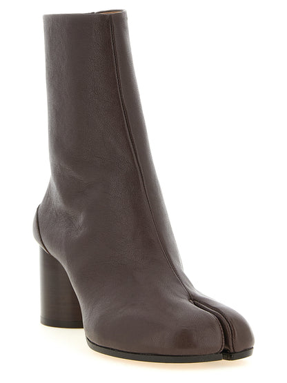 Ankle Boots by Maison Margiela for women in lamb leather brown, white & signature features an high-performance silhouette, showcasing the sophisticated design of the Women's Lamb Leather Ankle Boots with a and a refined .