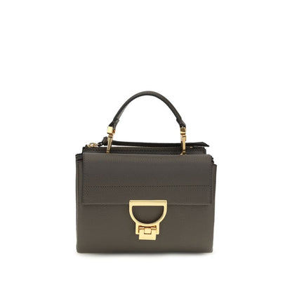 Flap Handbag by Coccinelle for women in bos taurus calfskin leather brown, gold, signature & monogram features a exquisite silhouette, showcasing a secure flap & zipper and exquisite with versatile shoulder-strap, handle & adjustable-strap for a exquisite finish.