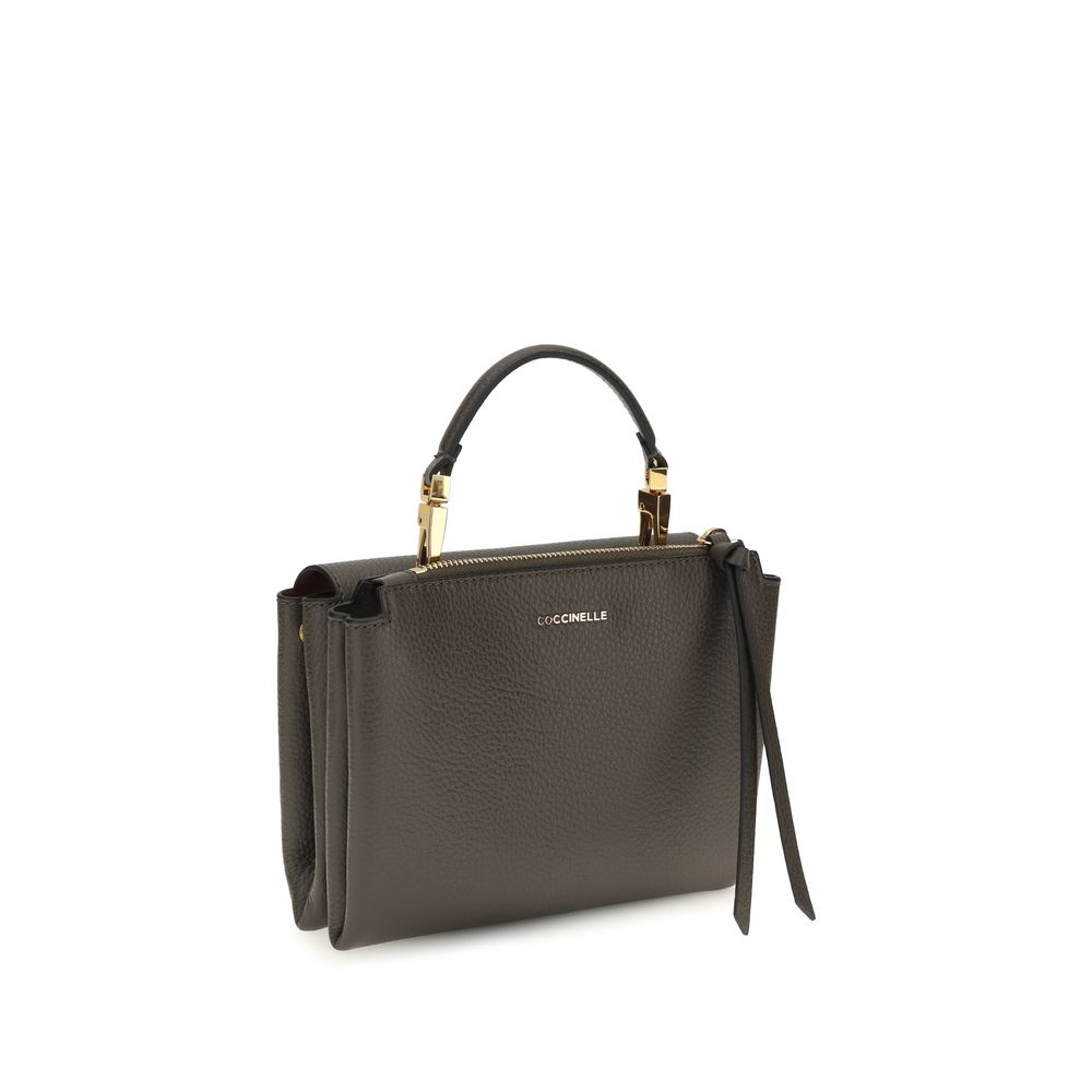 Flap Handbag by Coccinelle for women in bos taurus calfskin leather brown, gold, signature & monogram features a refined silhouette, showcasing a secure flap & zipper, organized , and versatile shoulder-strap, handle & adjustable-strap for a refined finish.