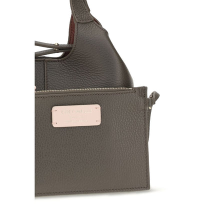 Small Crossbody Oval Handbag by Coccinelle for women in bos taurus calf grained leather brown & gold features an refined silhouette, showcasing a secure zipper & button, ample , and versatile crossbody-strap, shoulder-strap, handle, adjustable-strap & detachable-strap for a sophisticated refined aesthetic.