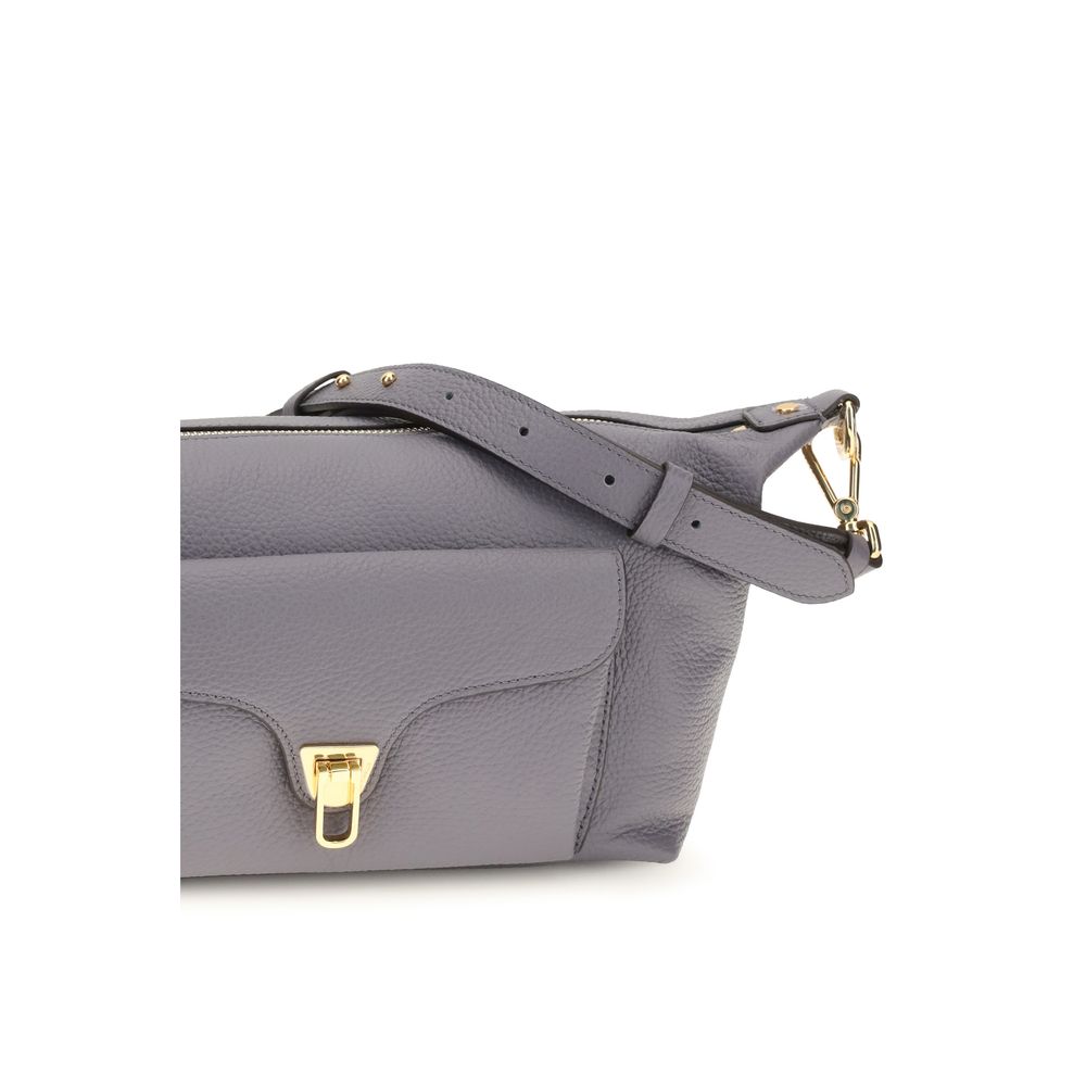 Shoulder Bag by Coccinelle for women in bos taurus calf leather gray, gold & signature features a distinguished silhouette, showcasing a secure zipper and distinguished external-pockets with versatile shoulder-strap & adjustable-strap for a distinguished finish.