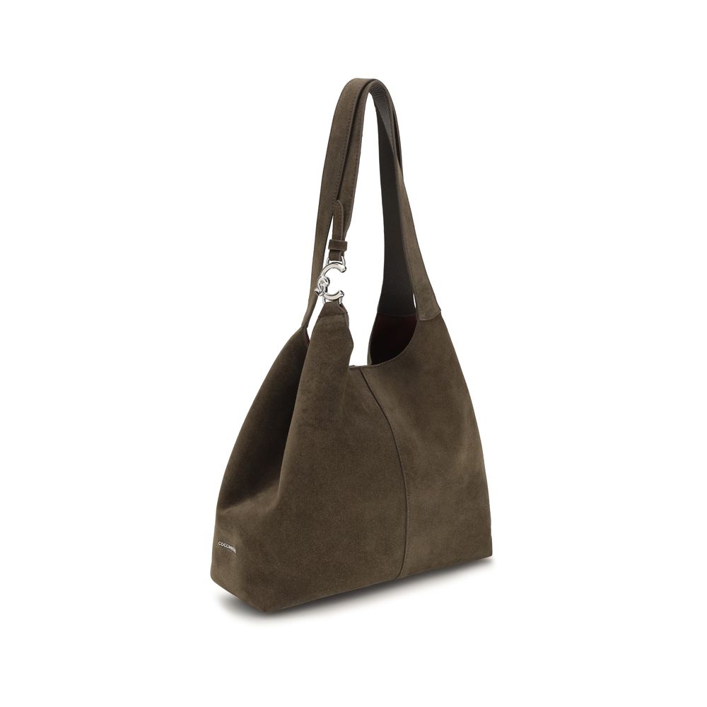 Large Shoulder Pouch Bag by Coccinelle for women in bos taurus calf leather brown & gold presents a versatile silhouette, showcasing a secure zipper, magnetic, clasp & button and versatile with versatile shoulder-strap & handle for a sophisticated look.