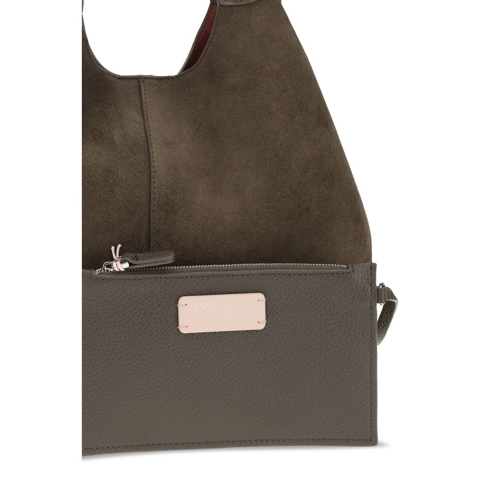 Large Shoulder Pouch Bag by Coccinelle for women in bos taurus calf leather brown & gold showcases a enviable silhouette, artfully detailed with a secure zipper, magnetic, clasp & button, organized , and versatile shoulder-strap & handle for a enviable look.