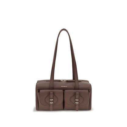 Shoulder Flap Bag by Coccinelle for women in bos taurus calf leather brown features an effortlessly chic silhouette with a secure flap & zipper, ample external-pockets, and versatile shoulder-strap & handle for effortlessly chic everyday luxury.
