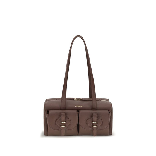 Shoulder Flap Bag by Coccinelle for women in bos taurus calf leather brown features an effortlessly chic silhouette with a secure flap & zipper, ample external-pockets, and versatile shoulder-strap & handle for effortlessly chic everyday luxury.