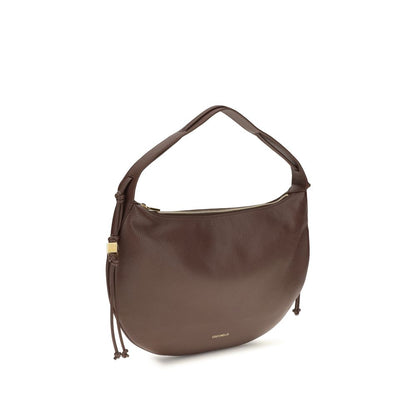 Shoulder Bag by Coccinelle for women in bos taurus grained calf leather brown, gold & signature showcases a enviable silhouette, artfully detailed with a secure zipper, organized , and versatile shoulder-strap for a enviable look.