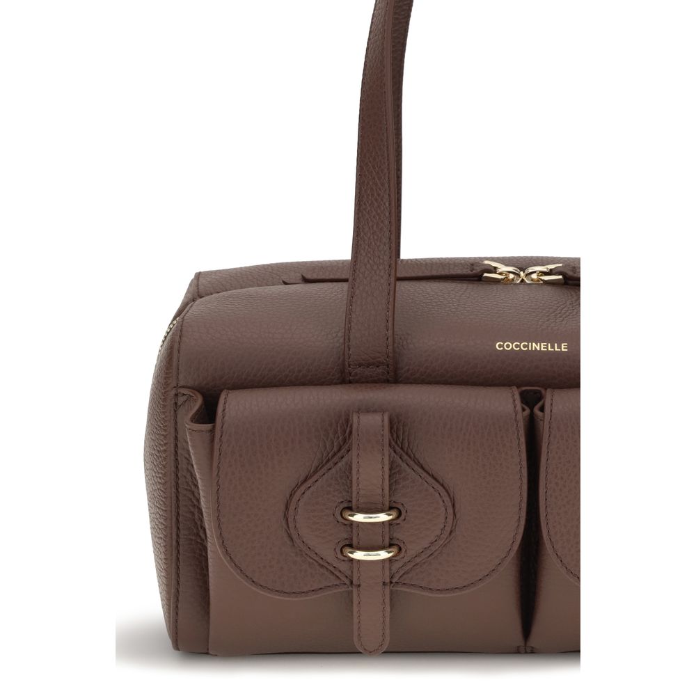 Shoulder Flap Bag by Coccinelle for women in bos taurus calf leather brown features a effortless sophistication silhouette, secured by a flap & zipper with ample external-pockets and versatile shoulder-strap & handle for a effortless sophistication finish.