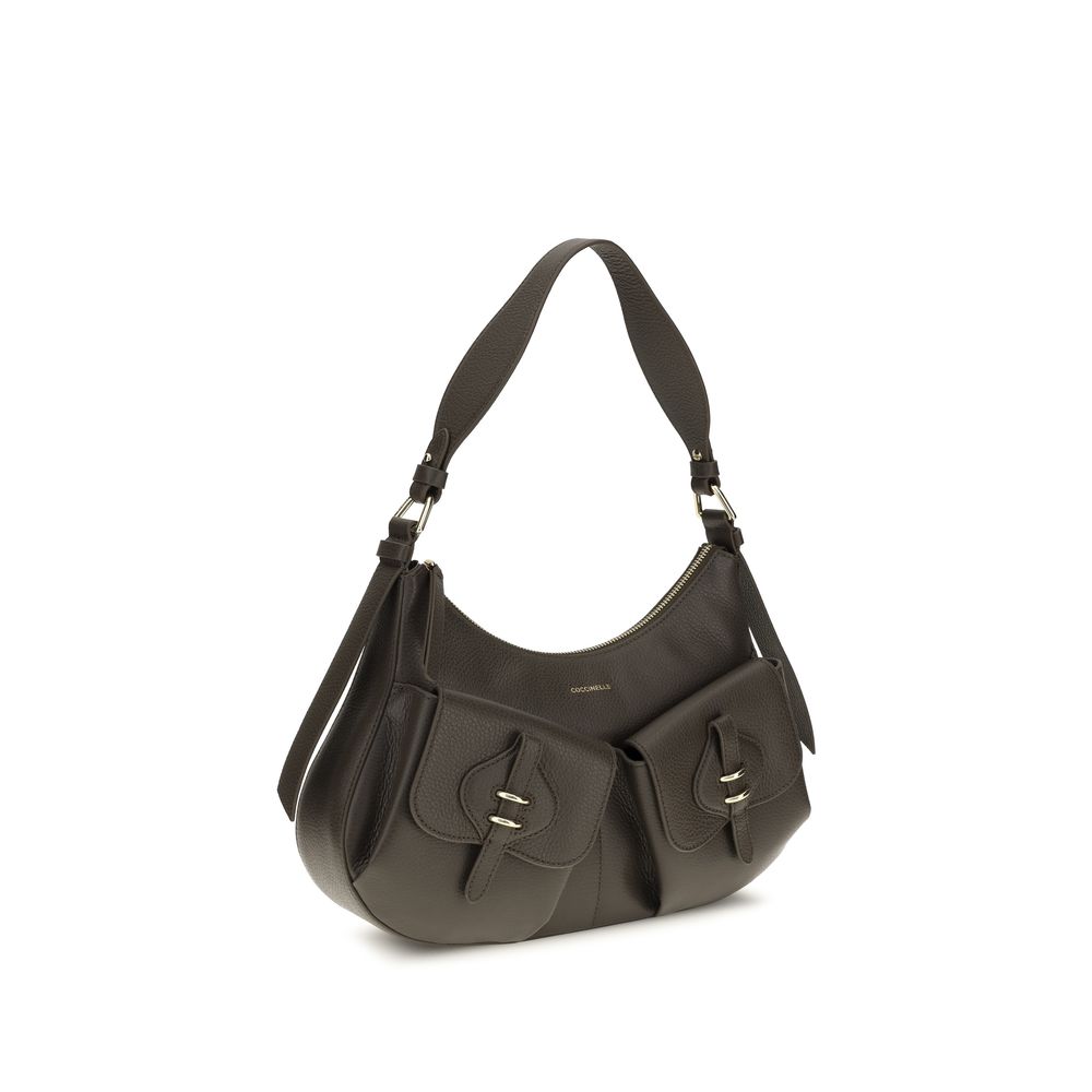 Small Shoulder Bag by Coccinelle for women in bos taurus calf leather brown & gold presents a versatile silhouette, showcasing a secure zipper & magnetic and versatile built-in-compartments with versatile shoulder-strap, adjustable-strap & handle for a sophisticated look.