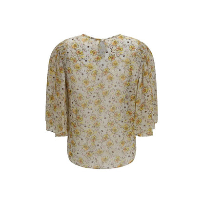 Blouse by Isabel Marant Étoile for women in viscose beige, toile, floral & print showcases a sublime silhouette, artfully detailed with a sublime round keyhole neckline and for a sophisticated, sublime finish.