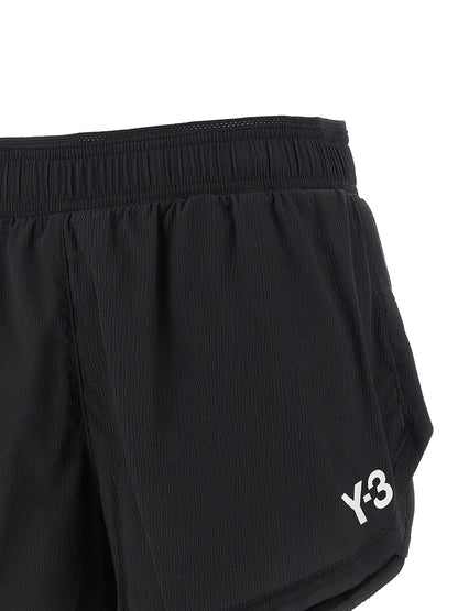 Bermuda Shorts by Y-3 for women in stretch polyamide black & print features an tailored silhouette, showcasing a tailored athletic & wide with a short and for a sophisticated look.