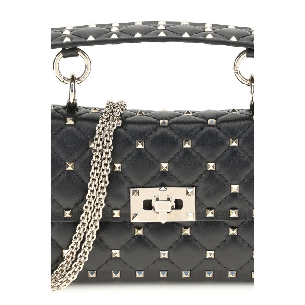 This Mini Quilted Handbag by Valentino Garavani for women in bos taurus calf nappa leather and black & signature presents a sculptural silhouette featuring a secure , ample , and versatile handle & detachable-strap for a sculptural finish.