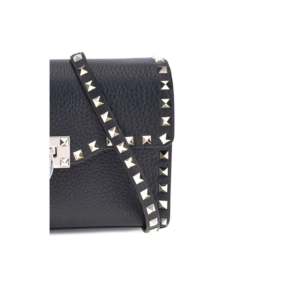 Mini Shoulder Bag by Valentino Garavani for women in bos taurus calfskin leather black & signature features a effortless chic silhouette with a secure hook, ample , and versatile shoulder-strap, adjustable-strap & handle for a effortless chic finish.