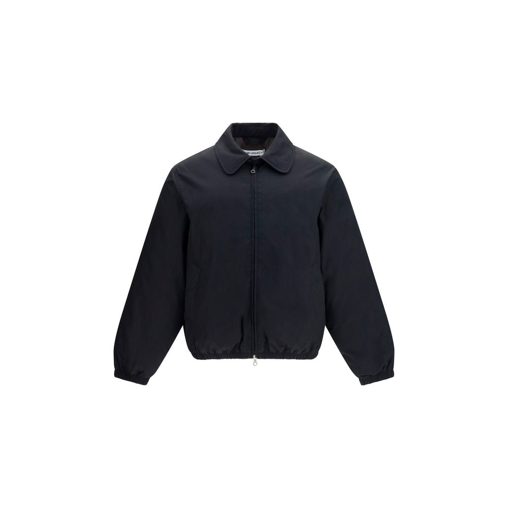 Overcoat by Our Legacy for men in nylon polyester cotton & goose-down black & signature presents a luxurious silhouette, showcasing a luxurious and sophisticated pockets & insulated for a premium, luxurious look.