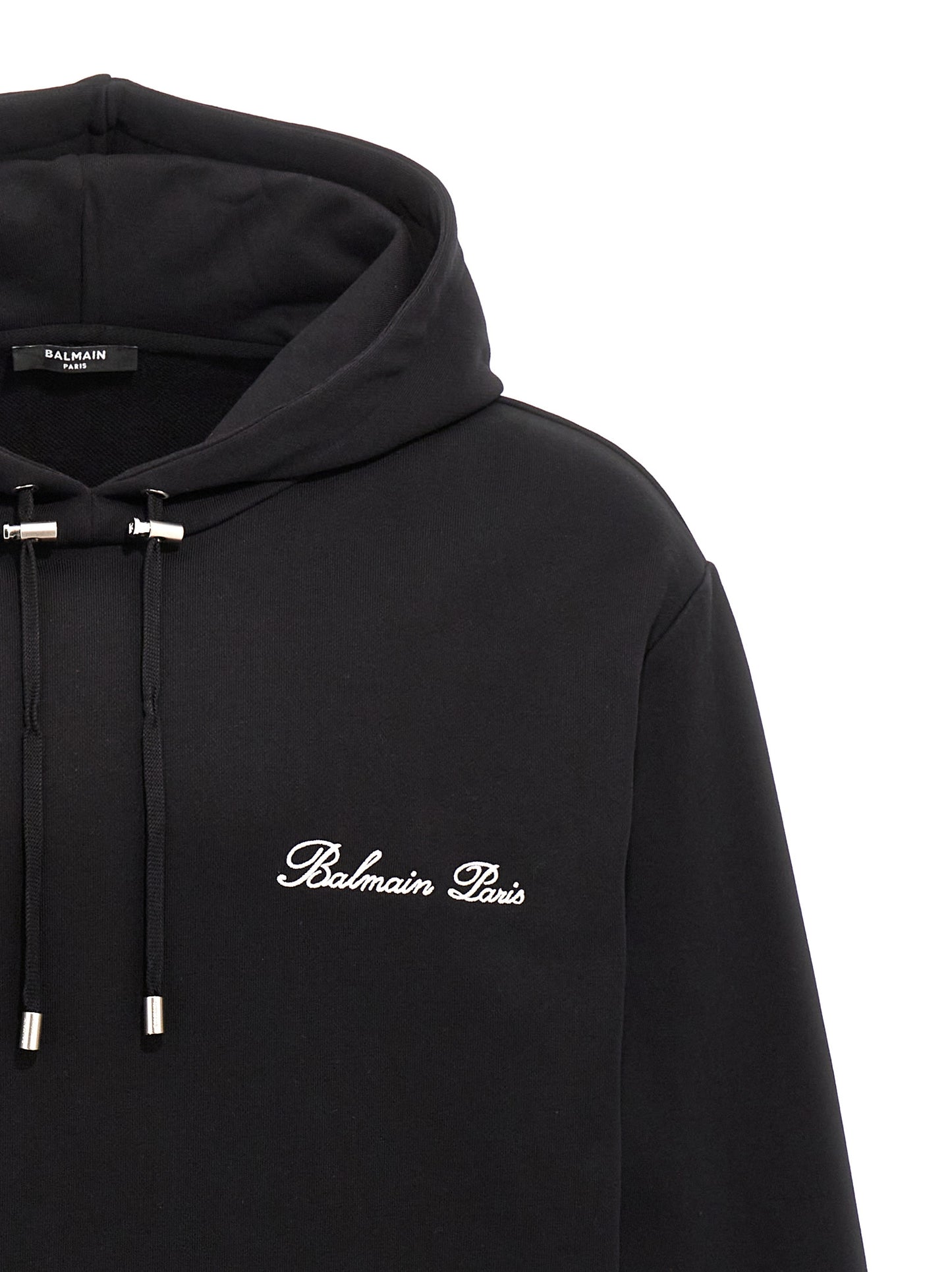 Sweatshirt Hoodie by Balmain for men in organic cotton black & signature features a slouchy chic silhouette, detailed with a slouchy chic and a signature hooded neckline for an elevated aesthetic.