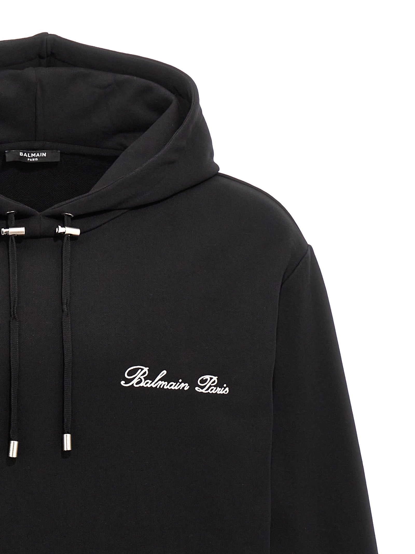 Sweatshirt Hoodie by Balmain for men in organic cotton black & signature features a slouchy chic silhouette, detailed with a slouchy chic and a signature hooded neckline for an elevated aesthetic.