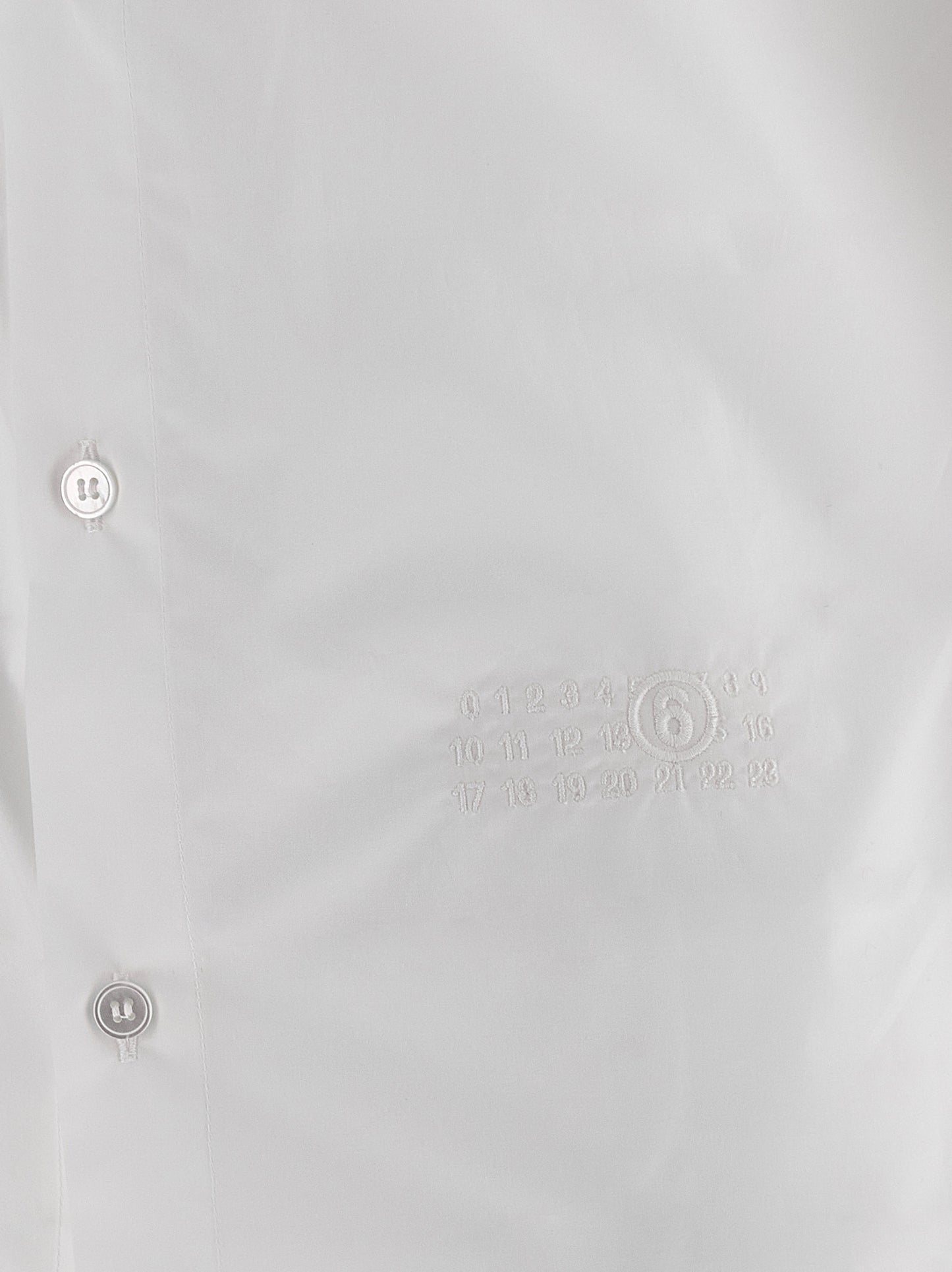 Blouse by MM6 Maison Margiela for women in cotton white & signature features an polished silhouette, showcasing a sophisticated and detail for a truly polished finish.