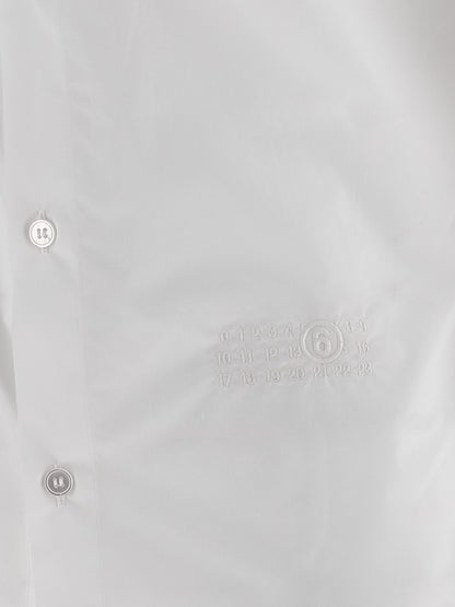 Blouse by MM6 Maison Margiela for women in cotton white & signature features an polished silhouette, showcasing a sophisticated and detail for a truly polished finish.
