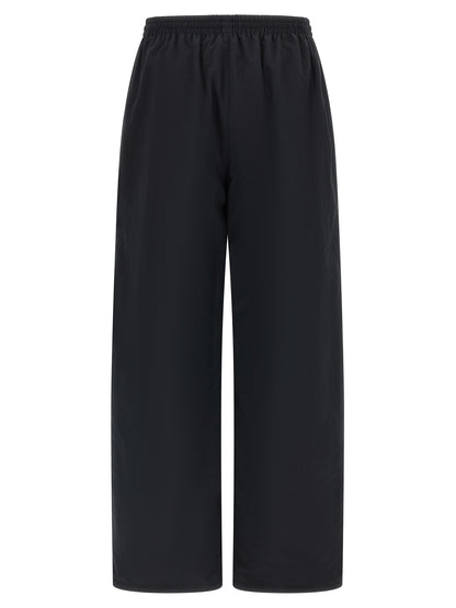 Activewear Pants by Balenciaga for women in nylon canvas multicolor features an streamlined design with , highlighting a streamlined straight-leg & athletic and long cut with a comfortable .