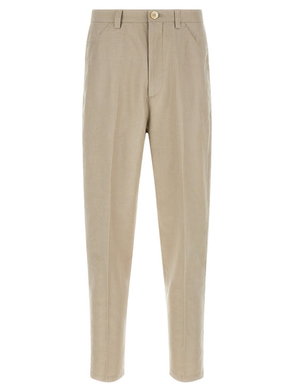 Trousers by Brunello Cucinelli for men in linen & cotton brown features a sculptural silhouette, showcasing a sculptural tapered-leg and long with a sophisticated for a sculptural finish.