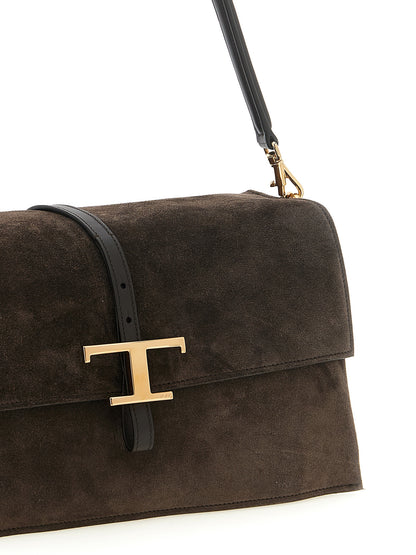 Small Shoulder Flap Bag by Tod's for women in suede calfskin leather brown, gold & signature features an effortlessly chic silhouette with a secure flap & magnetic, ample , and versatile shoulder-strap, adjustable-strap, detachable-strap & handle for effortlessly chic everyday luxury.