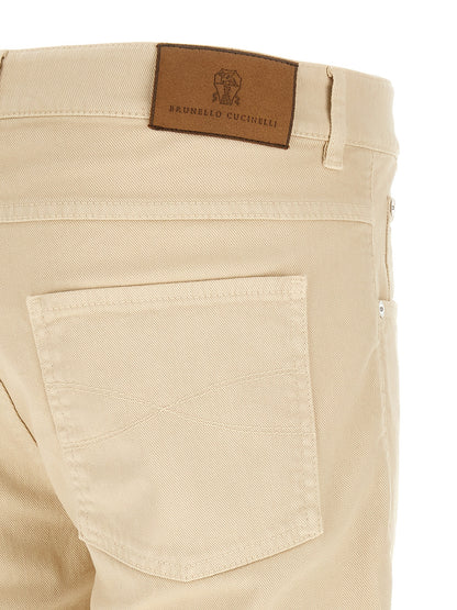 Jeans by Brunello Cucinelli for men in stretch denim cotton canvas beige features a polished silhouette with a polished tapered-leg & straight-leg, reaching a polished long and finished with a polished .