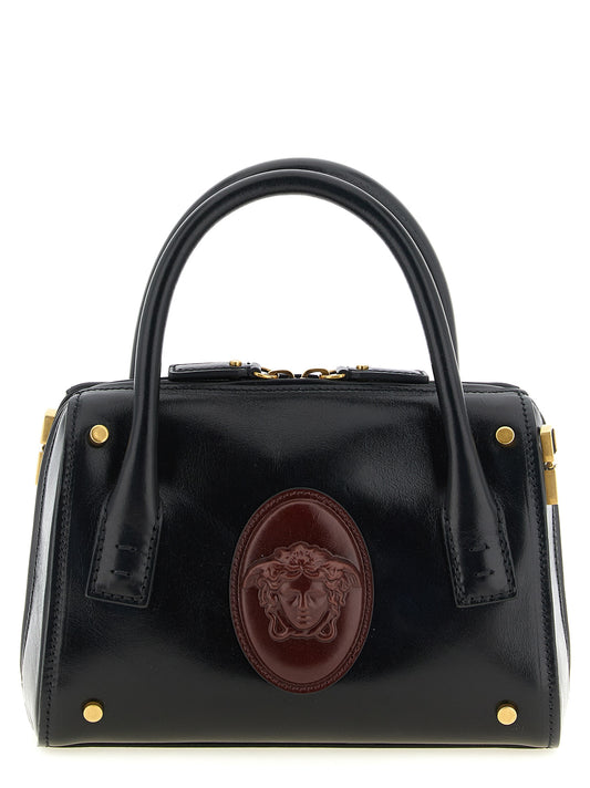 Small Handbag by Versace for women in calfskin leather black, burgundy & gold features a signature silhouette, showcasing a secure and signature with versatile shoulder-strap, handle & detachable-strap for a sophisticated look.
