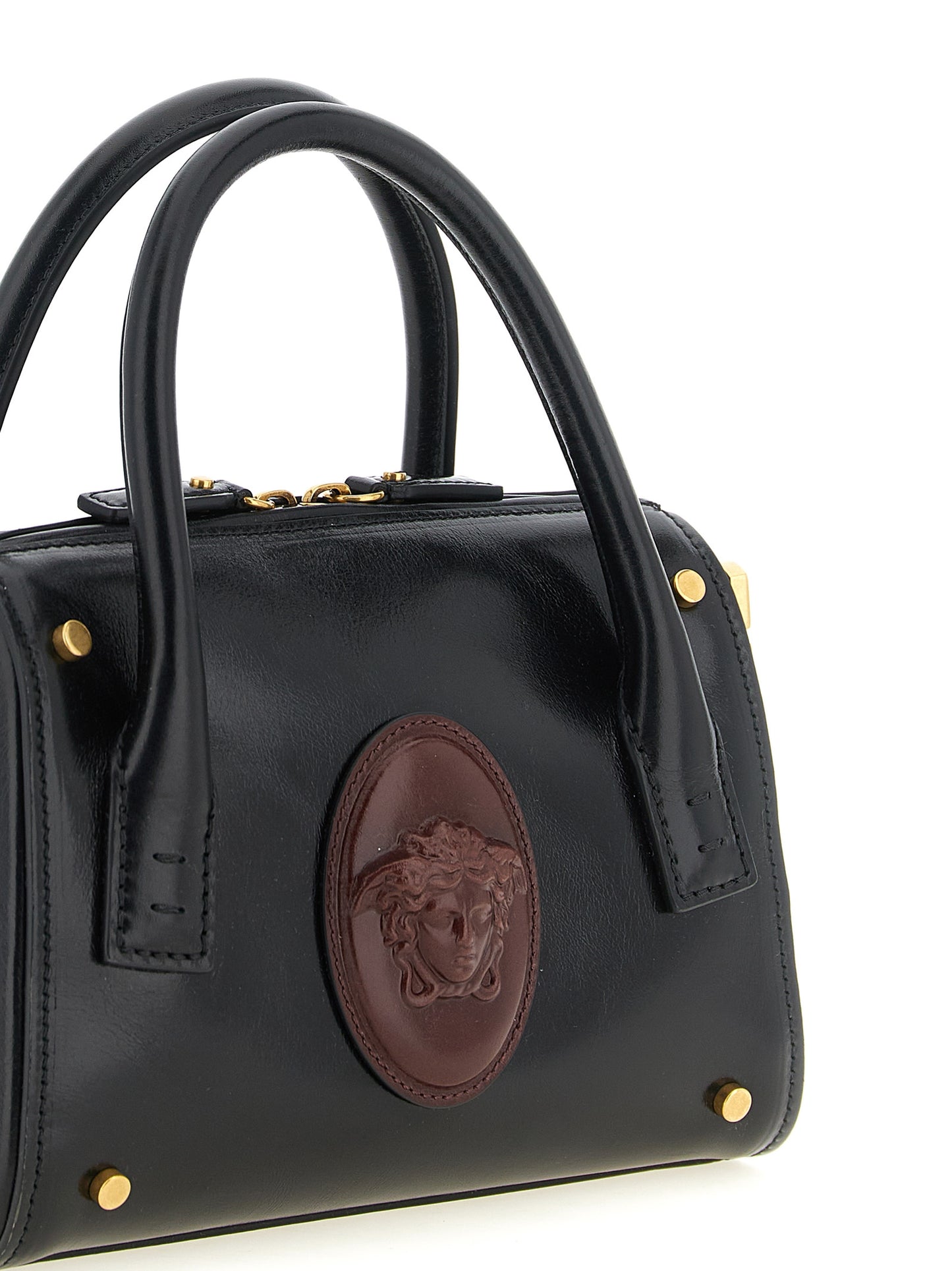 Small Handbag by Versace for women in calfskin leather black, burgundy & gold features a refined silhouette, showcasing a secure , organized , and versatile shoulder-strap, handle & detachable-strap for a refined finish.