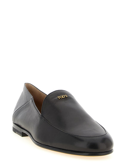 This Flat Moccasin Moccasins Loafer Slip-On Slippers Shoes by Tod's for women in nappa lamb leather black & gold features an exquisite silhouette from the Women's Nappa Lamb Leather Flat Moccasin Moccasins Loafer Slip-On Slippers Shoes collection, defined by a sophisticated flat and elegant .