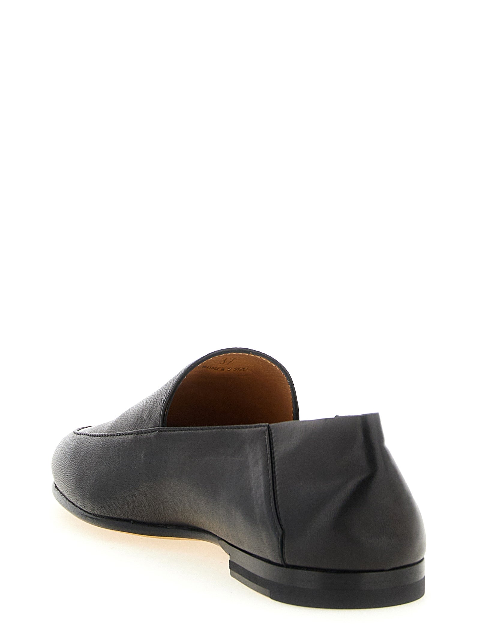 This Flat Moccasin Moccasins Loafer Slip-On Slippers Shoes by Tod's for women in nappa lamb leather black & gold features an exquisite silhouette from the Women's Nappa Lamb Leather Flat Moccasin Moccasins Loafer Slip-On Slippers Shoes collection, defined by a sophisticated flat and elegant .