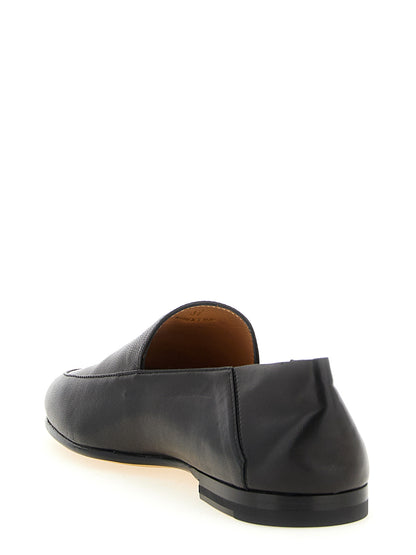 This Flat Moccasin Moccasins Loafer Slip-On Slippers Shoes by Tod's for women in nappa lamb leather black & gold features an exquisite silhouette from the Women's Nappa Lamb Leather Flat Moccasin Moccasins Loafer Slip-On Slippers Shoes collection, defined by a sophisticated flat and elegant .