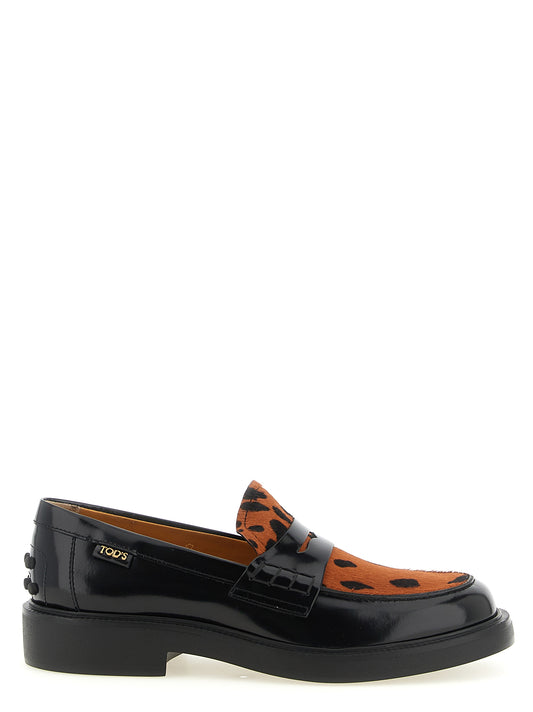 Flat Moccasin Moccasins Loafer Slip-On Shoes by Tod's for women in calfskin leather black, leopard-print, signature & print showcases a resplendent Gommini Pony Women's Calfskin Leather Flat Moccasin Moccasins Loafer Slip-On Shoes aesthetic, defined by its resplendent and elegant flat.