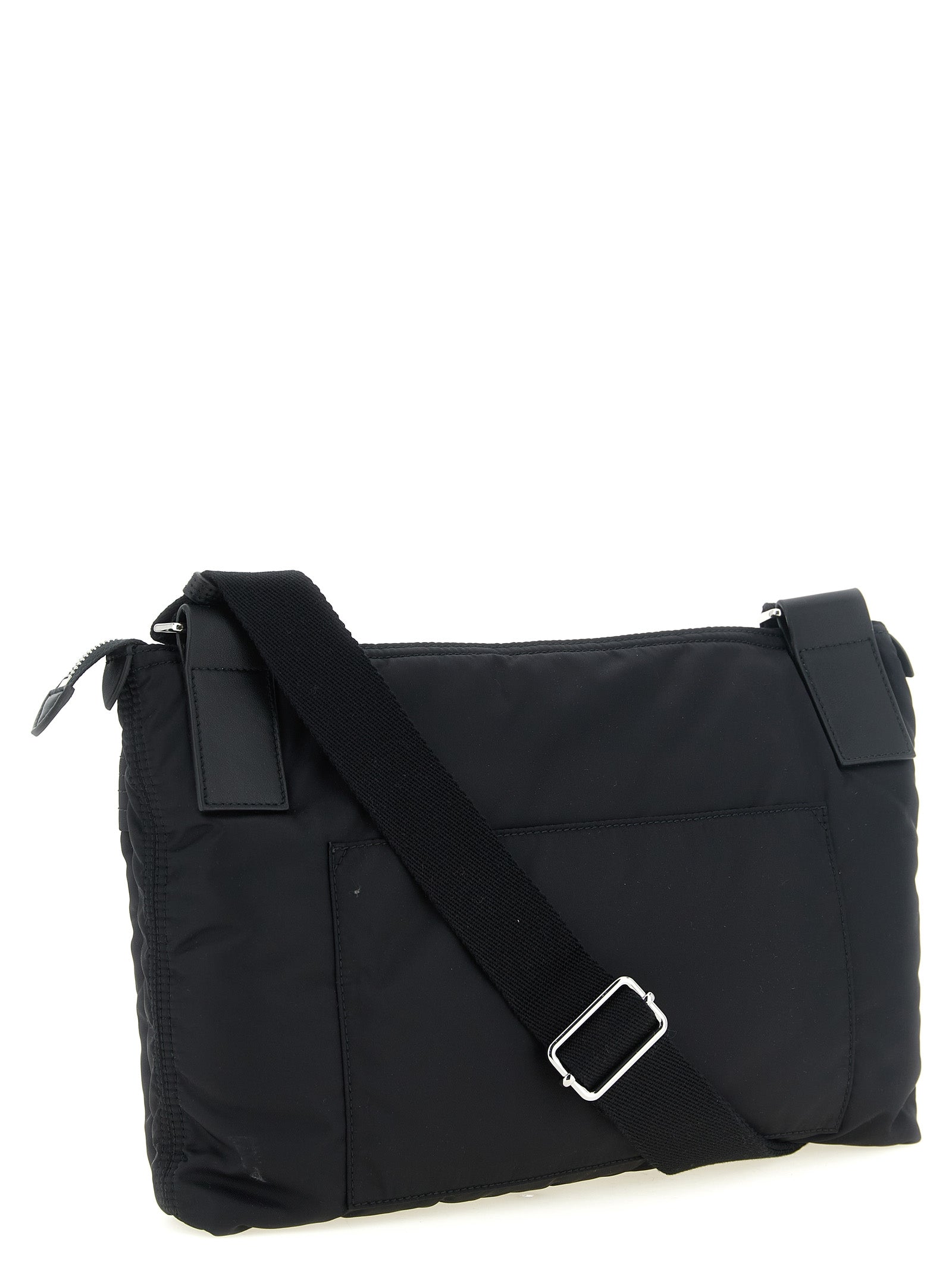 This East West Crossbody Messenger Bag by Maison Margiela for men in polyamide patent leather black, silver, white & signature presents a versatile silhouette from the Four Stitches Zip Computer Polyamide Patent Leather East West Crossbody Messenger Bag collection, featuring a secure zipper, ample external-pockets, and versatile crossbody-strap, shoulder-strap & adjustable-strap.