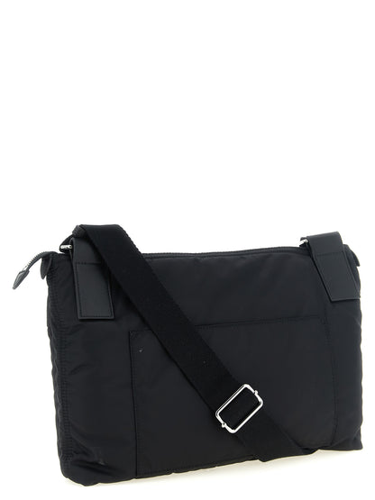 This East West Crossbody Messenger Bag by Maison Margiela for men in polyamide patent leather black, silver, white & signature presents a versatile silhouette from the Four Stitches Zip Computer Polyamide Patent Leather East West Crossbody Messenger Bag collection, featuring a secure zipper, ample external-pockets, and versatile crossbody-strap, shoulder-strap & adjustable-strap.