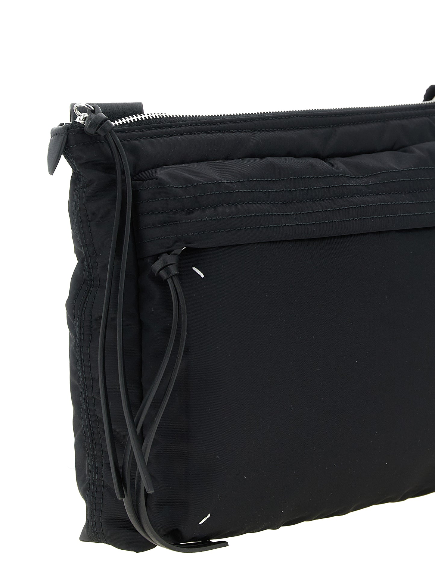 East West Crossbody Messenger Bag by Maison Margiela for men in polyamide patent leather black, silver, white & signature features a statement-making Four Stitches Zip Computer Polyamide Patent Leather East West Crossbody Messenger Bag design with a secure zipper, statement-making external-pockets, and versatile crossbody-strap, shoulder-strap & adjustable-strap for a sophisticated look.