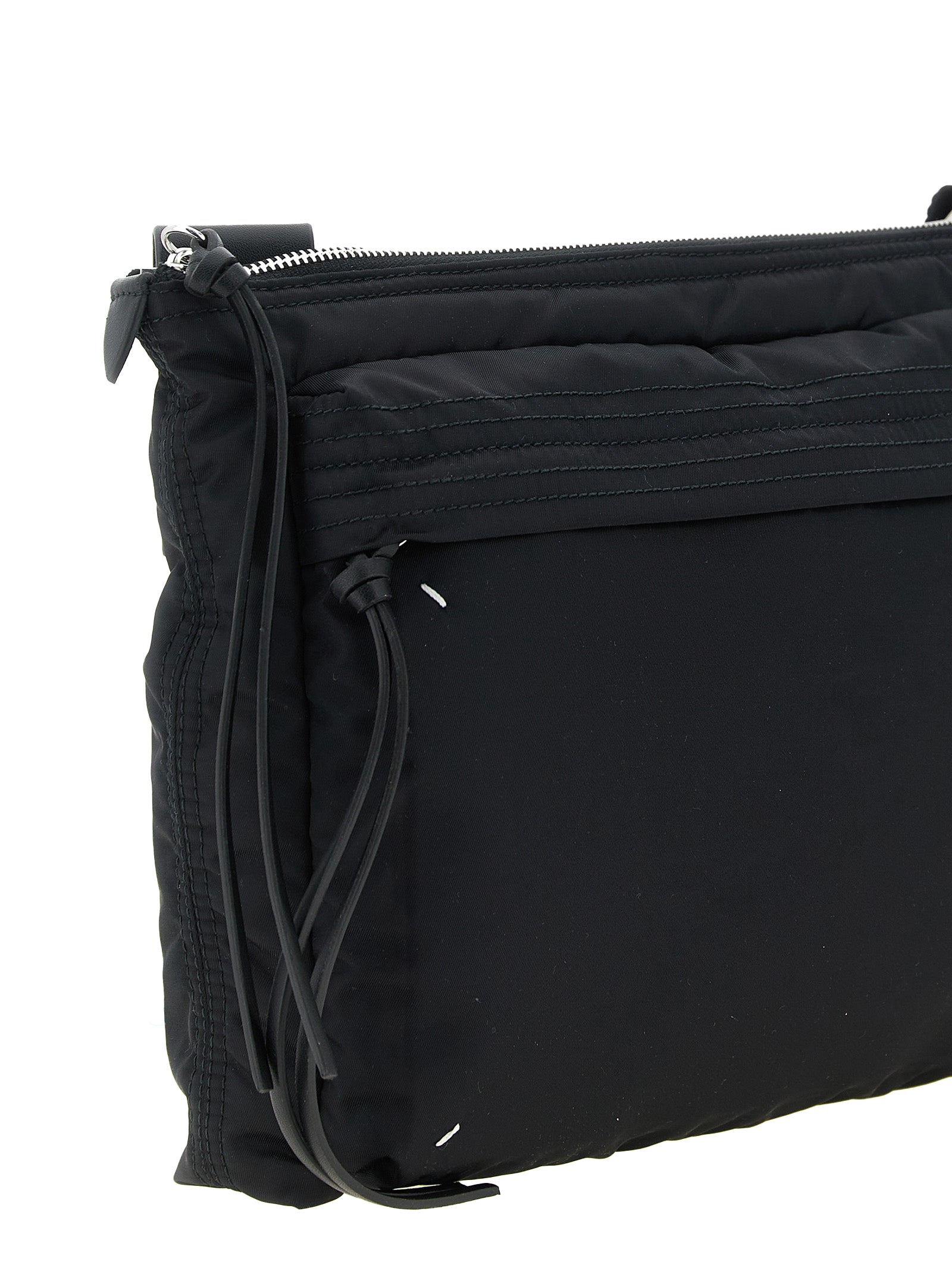 East West Crossbody Messenger Bag by Maison Margiela for men in polyamide patent leather black, silver, white & signature features a statement-making Four Stitches Zip Computer Polyamide Patent Leather East West Crossbody Messenger Bag design with a secure zipper, statement-making external-pockets, and versatile crossbody-strap, shoulder-strap & adjustable-strap for a sophisticated look.